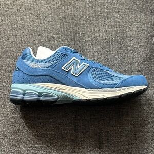 New Balance Men's 2002R Sneaker in Light Blue and White